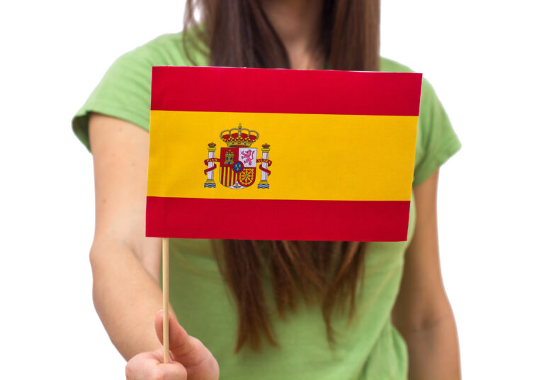 Spain,Flag,,Unrecognizable,Female,Person,,Holding,In,Hands,over,White,Background.