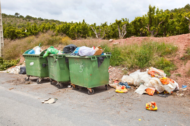 Overflowing,Bins,Next,To,Orange,Orchard,,Valencia,Region,,Spain