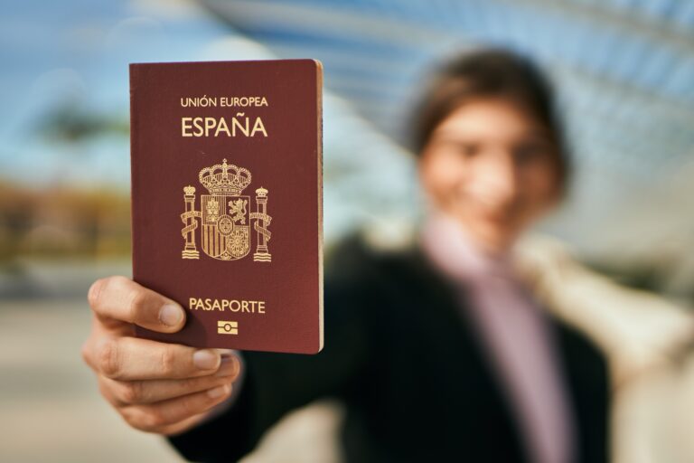 Young,Beautiful,Businesswoman,Smiling,Happy,Holding,Spainish,Passport,At,The
