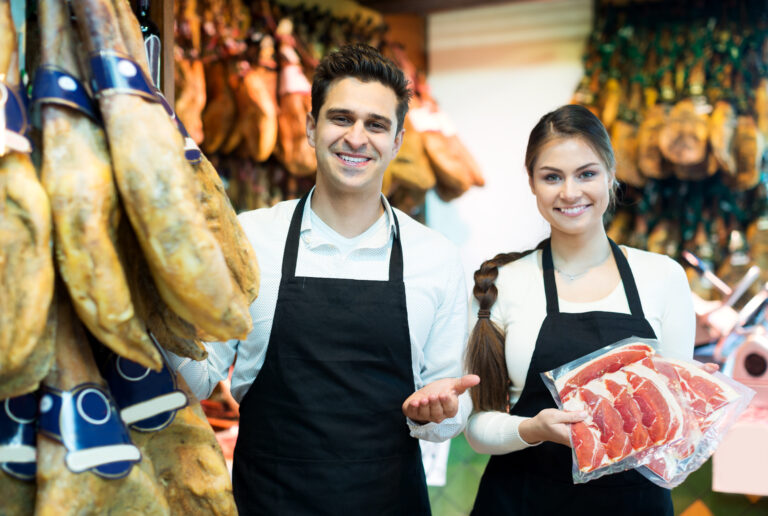 Portrait,Of,Beautiful,Sellers,Offering,Tasty,Jamon,For,Customers,In
