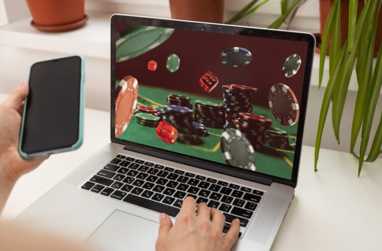 Man,Betting,On,Sports,Using,Laptop,At,Table,,Closeup.,Bookmaker